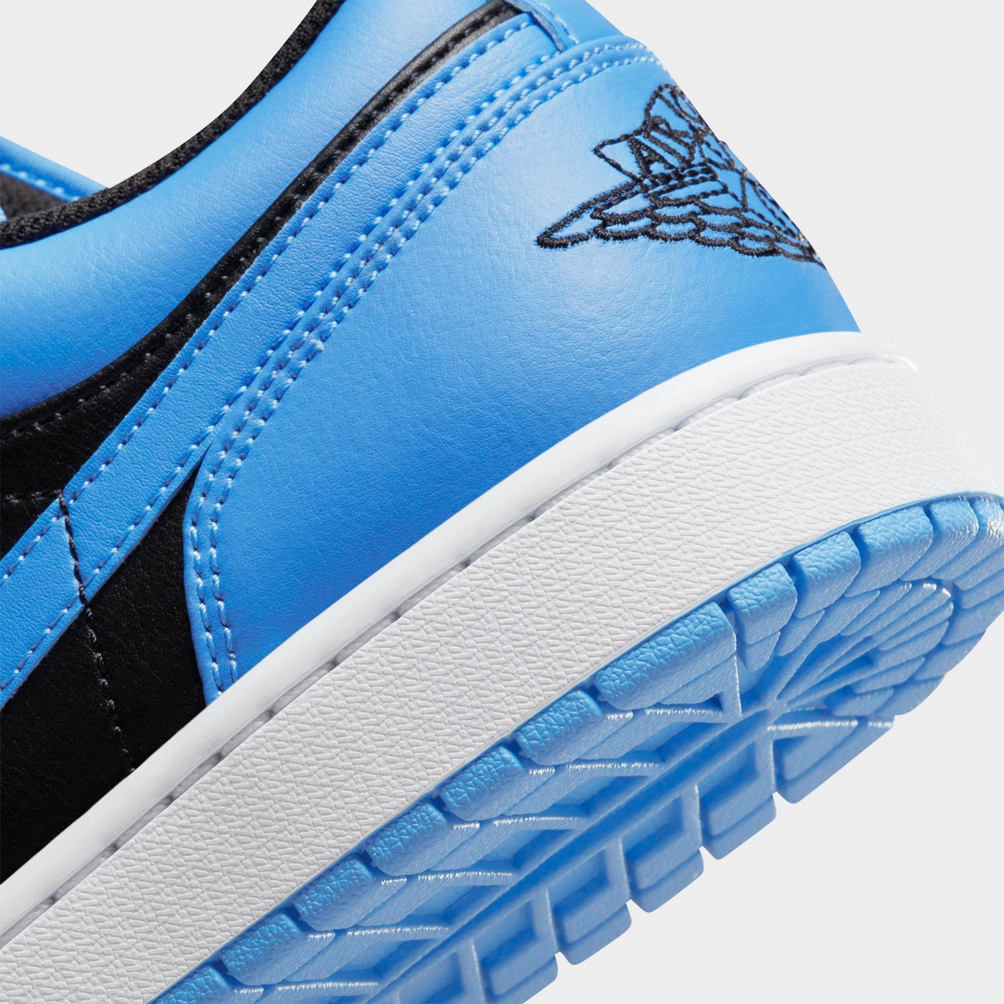 Jordan 1 Low Black / Black - University Blue