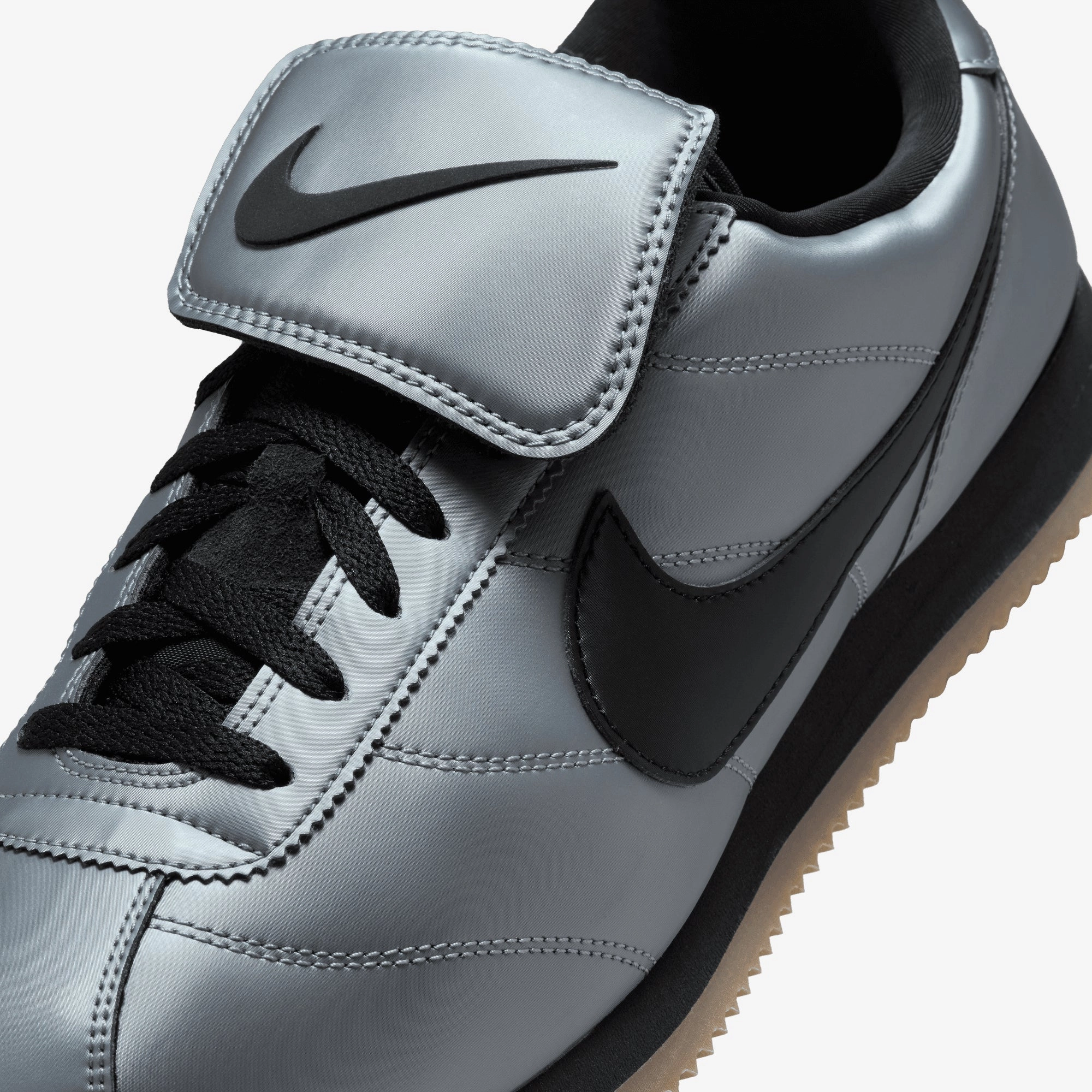 NIKE | CORTEZ { MTLC COOL GREY/BLACK-GUM DARK BROWN